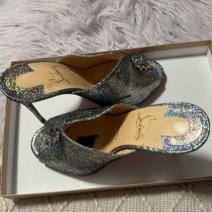 Christian Louboutin size 37 silver iridescent slides.
